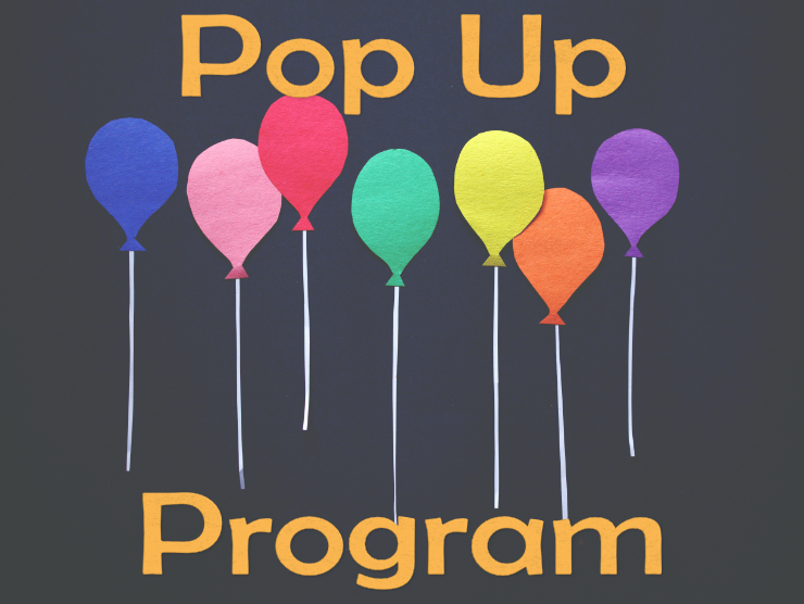 Colorful balloons made of construction paper on a dark background with the text Pop Up Program