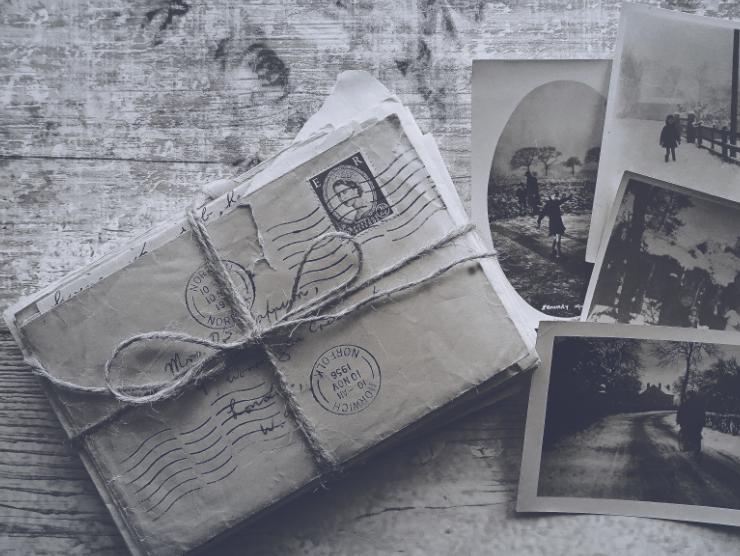 Black and white picture of old envelopes and photos